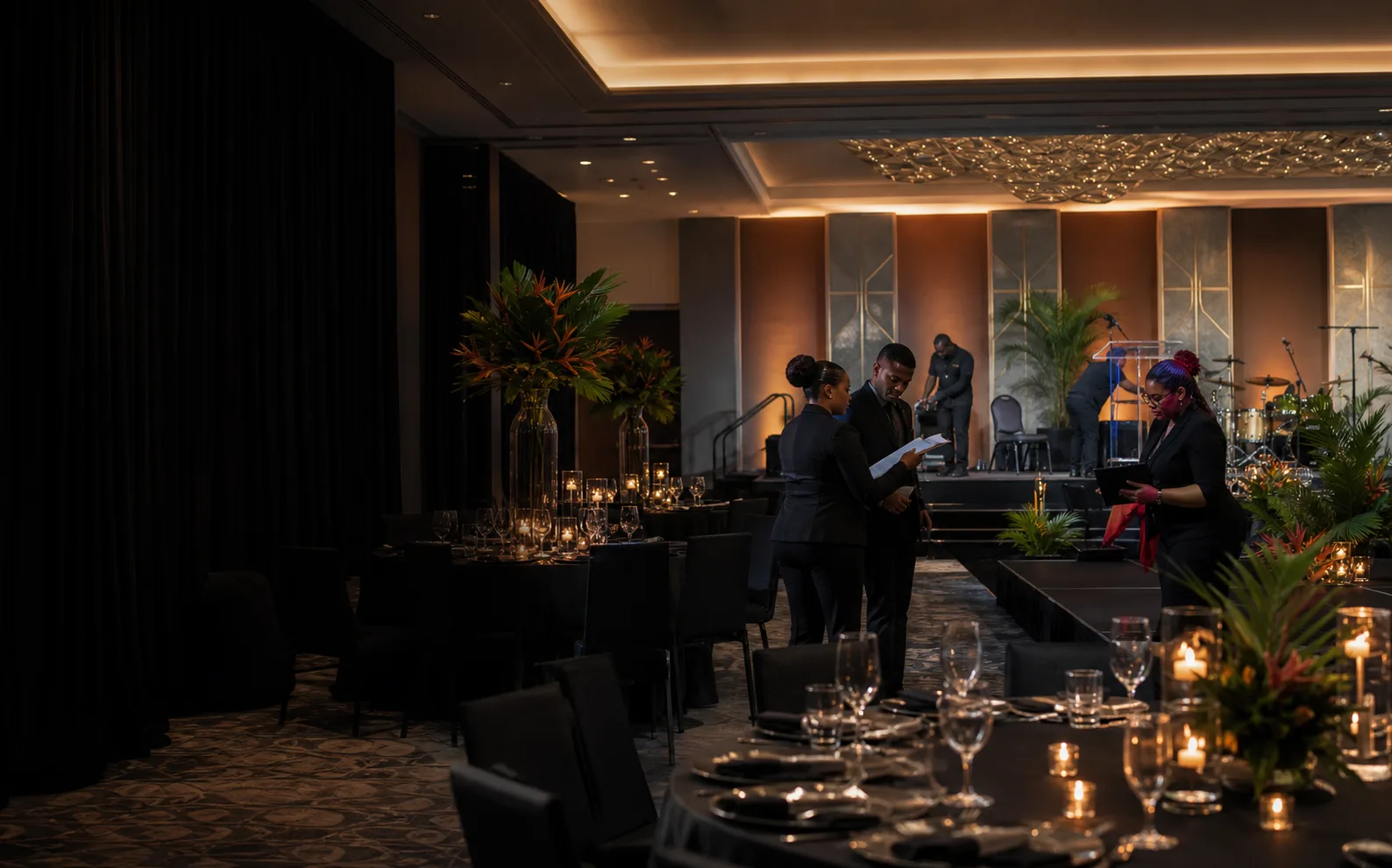 Event production team completing final preparations for a corporate gala